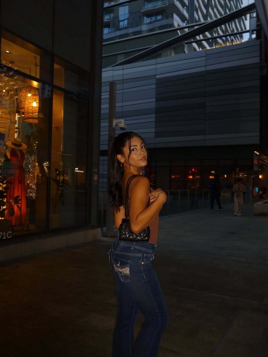 Daniela on a Brickell street at night, camera flash